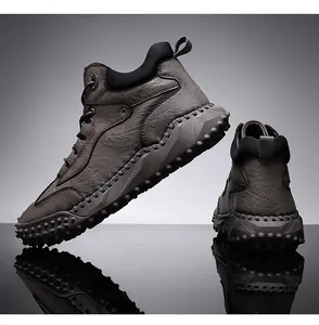 Rugged men's high-top outdoor leather hiking boots with non-slip studded sole of rubber.