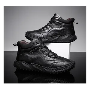 Detailed side view of black high-top leather outdoor boots with non-slip rubber soles