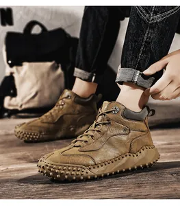 Close-up of men's high-top outdoor leather hiking boots with rugged anti-slip sole