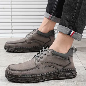 Bottines en cuir gris pour hommes avec semelles cousues main et fermeture à lacets