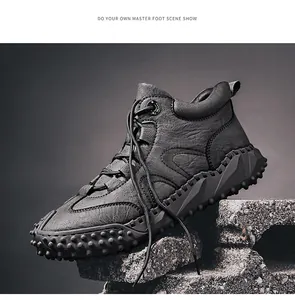 Detailed side profile of high-top leather outdoor hiking boots with rugged sole