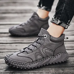 Durable men's high-top outdoor leather hiking boots with non-slip rubber soles in grey