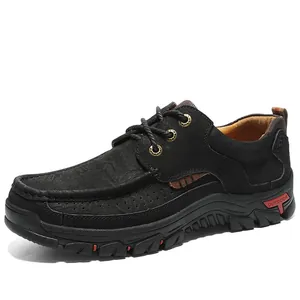 Close-up detail of black genuine leather outdoor shoes featuring thick rubber soles