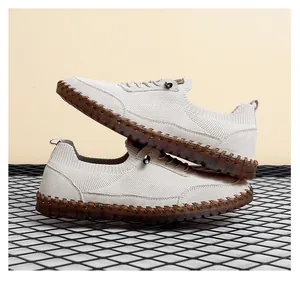 Close-up detail of breathable mesh men's casual shoes with stitched durable rubber soles.