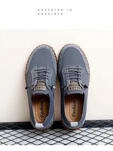 Top view of breathable grey mesh men's casual shoes with hand-stitched gum soles