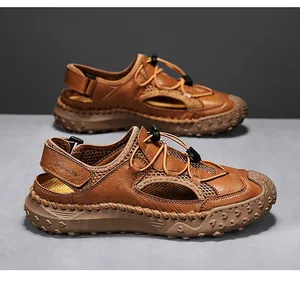 Detailed side view of brown leather men's outdoor sandals with mesh panels