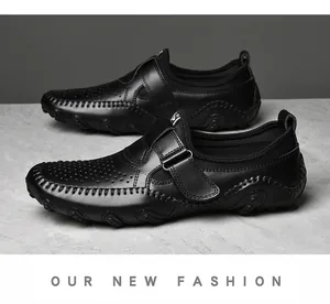 Detail view of black breathable perforated loafers with comfortable slip-on design.