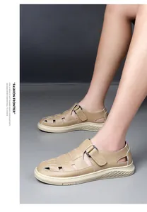 Detailed side view of beige hollow-out men's sandals with breathable mesh design.
