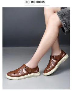Detailed view of breathable brown leather hollow-out men's sandals with a sturdy non-slip sole