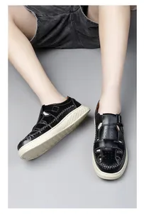 Detail view of men's breathable hollow-out leather sandals with closed-toe design