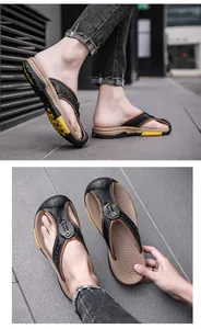 Detail view of men's leather flip-flops with anti-slip rubber soles for outdoors.