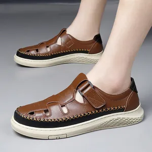 Men's breathable hollow-out leather sandals with non-slip thick soles for summer wear.