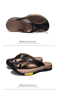 Close-up detail of men's genuine leather flip flops with a high-grip rubber sole