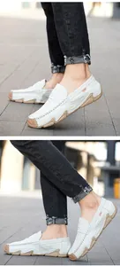 Detail of white crocodile textured leather loafers for men with soft rubber soles
