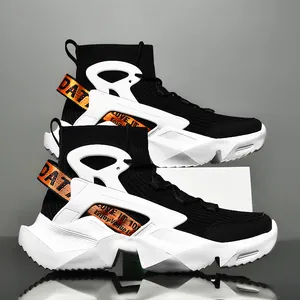 Modern high-top black and white sock sneakers for men featuring stylish orange straps