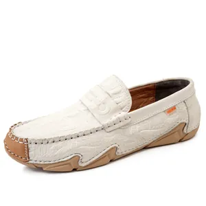 Men's white leather driving loafers with crocodile texture and flexible brown sole