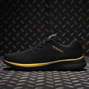 Detailed side view of black flyknit sneakers with gold accents and Fashion logo.