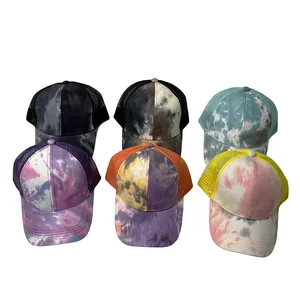 Detailed showcase of diverse tie-dye mesh trucker hats featuring vibrant patterns
