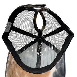 Internal view of tie-dye camouflage mesh hat showing ponytail hole and breathable material
