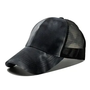 Detailed view of black tie-dye mesh trucker baseball cap showing breathable fabric