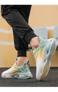 Detail of breathable men's running shoes with colorful gradient and air cushion sole.