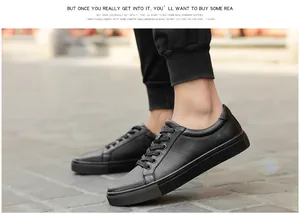 Detailed view of black breathable cowhide leather low-top casual sneakers with laces