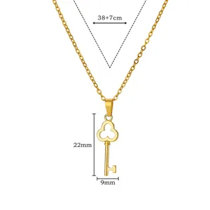 Macro view of the 18K gold plated key pendant showing precise dimensions 22x9mm.