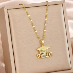 Detailed shot of 2026 graduation cap necklace in gold finish with sparkling crystals