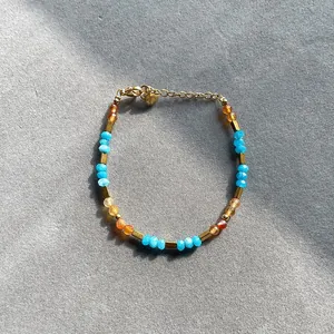 Handmade faceted natural stone beaded bracelet with vibrant candy colors and gold spacers