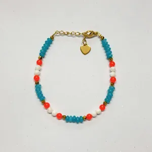 Close-up detail of the colorful dopamine faceted stone beaded bracelet with golden heart charm