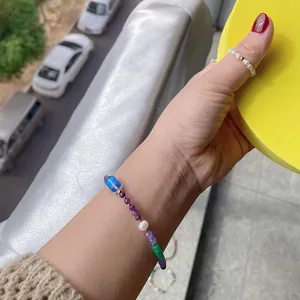 Detailed view of a colorful dopamine beaded bracelet with natural stones and pearl