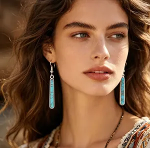 Vintage Bohemian long turquoise drop earrings on a model for a chic ethnic look
