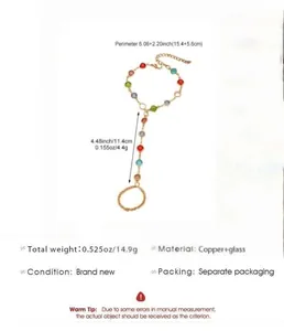 Detail view of copper slave bracelet with colorful glass beads and specifications