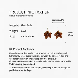 Detail view of brown resin floral earrings with specific size and material specifications.