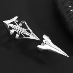 Detailed view of gothic silver metal pointed fingernail armor rings for women in punk style