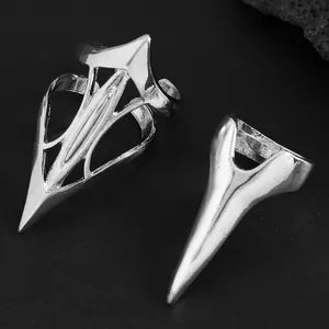 Detailed view of silver punk nail armor rings with intricate gothic shield designs