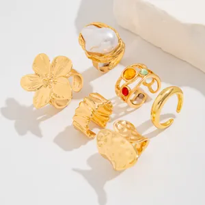 Elegant gold-plated ring set with liquid lava, flower designs and Baroque pearl accents
