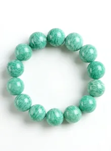 Detailed shot of natural green amazonite beaded bracelet with snowflake texture