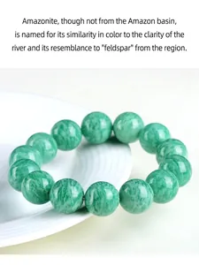 Close-up of polished natural green Amazonite round bead bracelet resting on a white plate