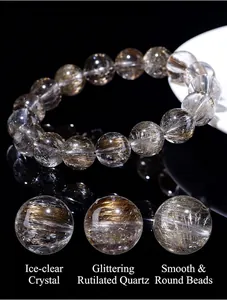 Macro detail of natural 7A silver rutilated quartz beads with shiny rutile needles