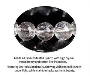 Close-up macro detail of natural silver rutilated quartz beads showing metallic rutile hair