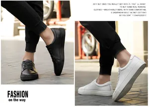 Detail view of men's leather low-top sneakers in classic black and white colors