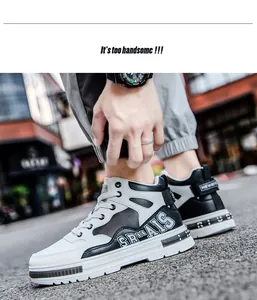 Detail view of black and white high-top micro-fiber leather sneakers on the street