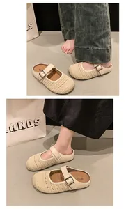 Close-up of beige woven mesh Mary Jane mules with adjustable buckle strap detail