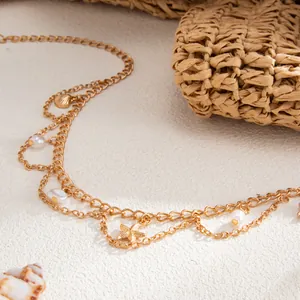 Bohemian gold body chain with starfish shell charms and pearls for beach vacation