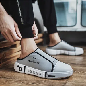 Stylish light gray breathable slip-on mules with thick white soles for outdoor casual wear