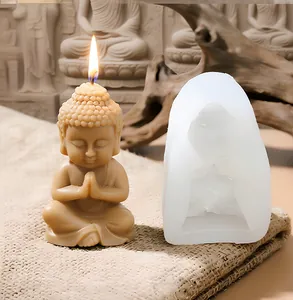 Detail view of the Buddha silicone mold alongside a lit Zen Buddha candle figure