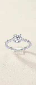 Macro shot of a S925 sterling silver ring with a round brilliant cut moissanite stone.