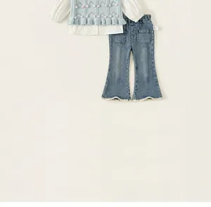 Close-up of toddler girl's two-piece set featuring knit vest and flare denim jeans