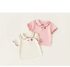 Detail view of sweet doll collar and strawberry embroidery on girls' short-sleeve t-shirt